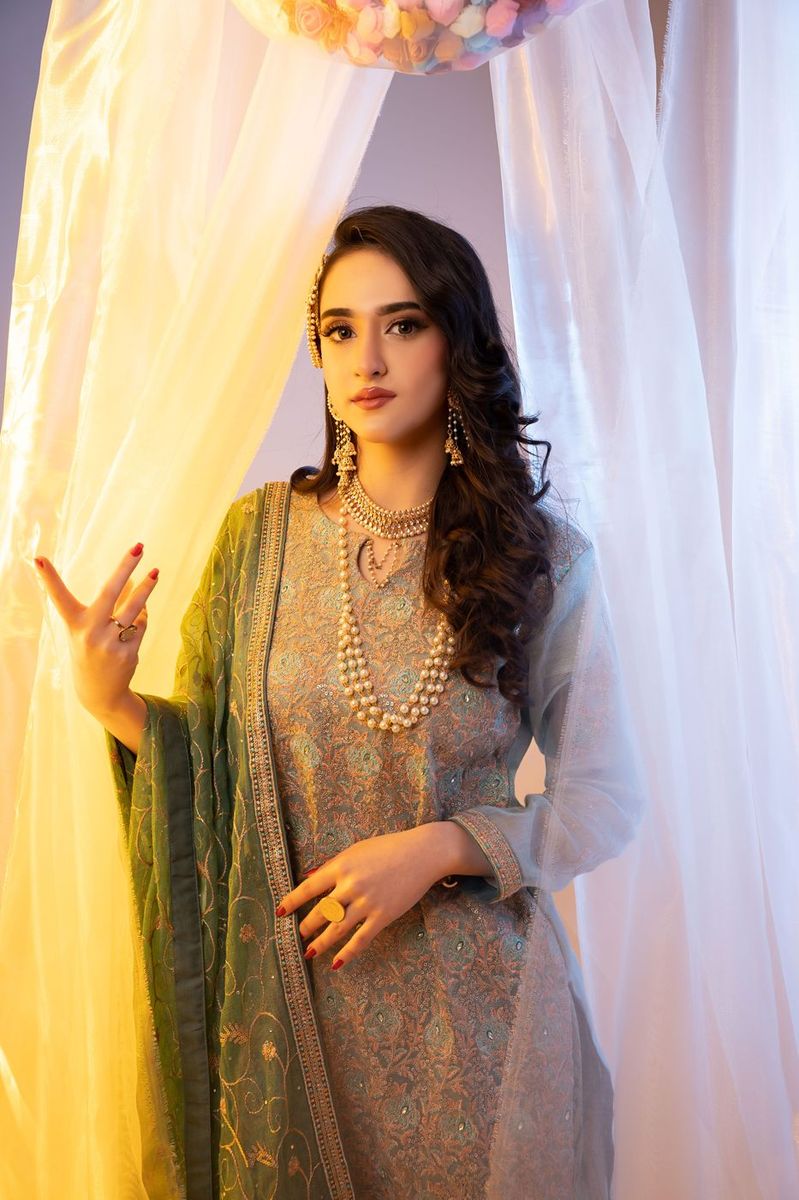 Mehndi look behind sheer curtains