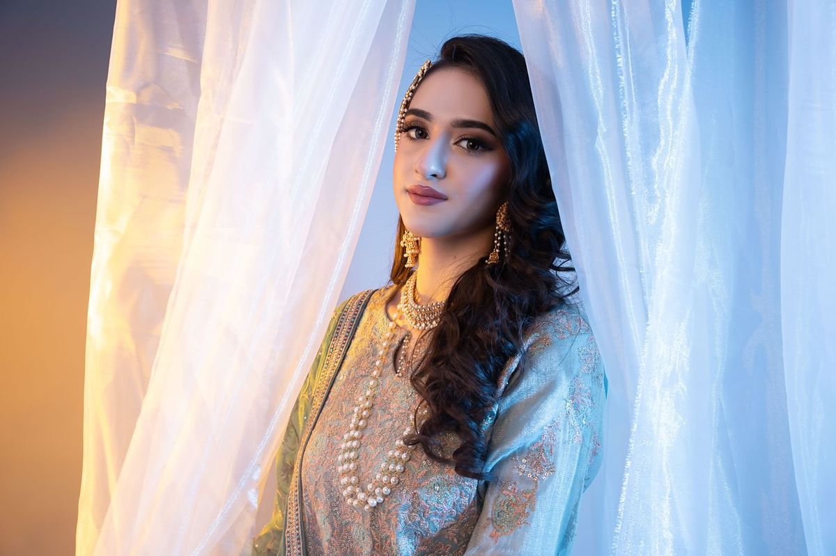 Mehndi look behind sheer curtains