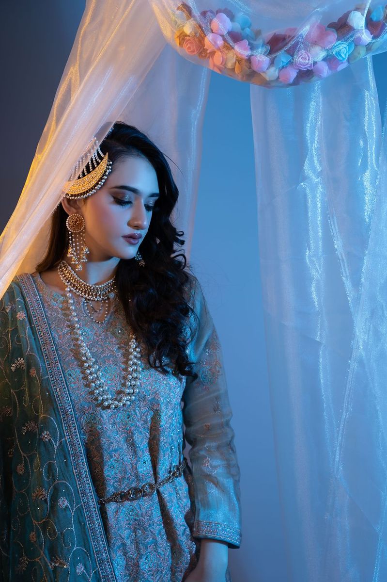 Mehndi look behind sheer curtains
