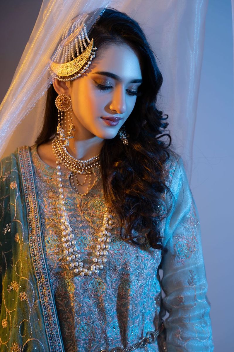Mehndi look behind sheer curtains