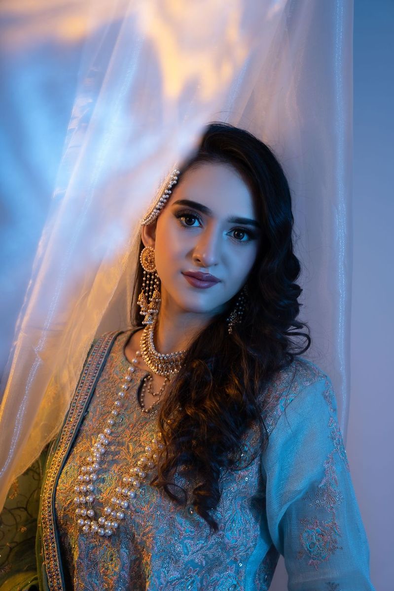 Mehndi look behind sheer curtains