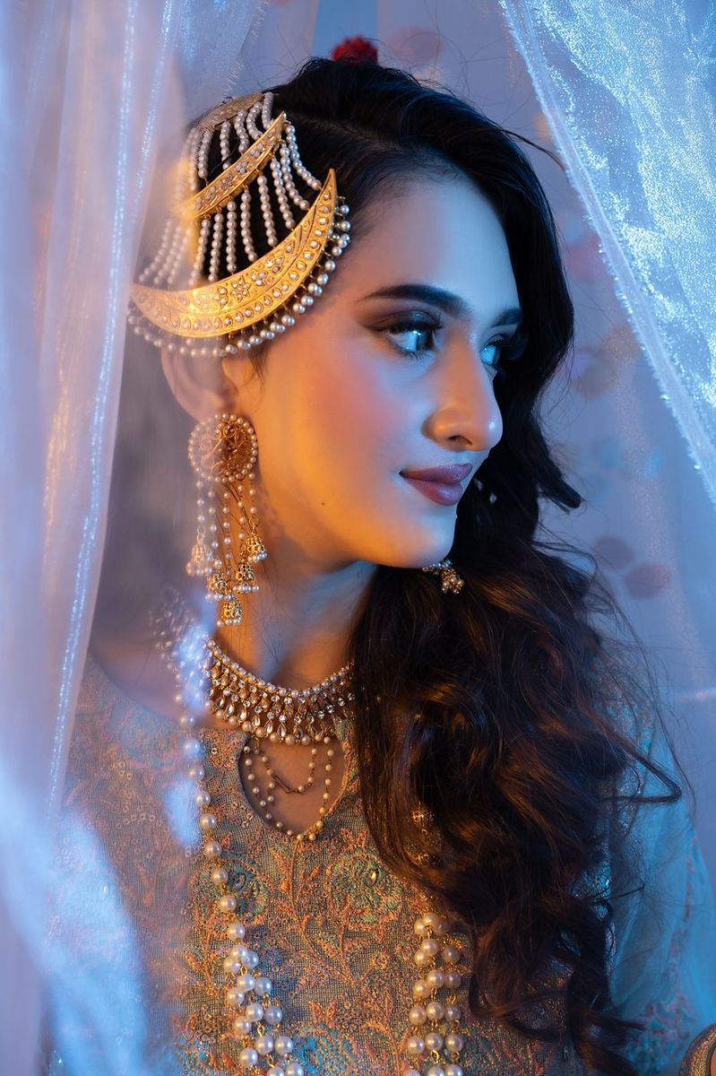 Mehndi look behind sheer curtains