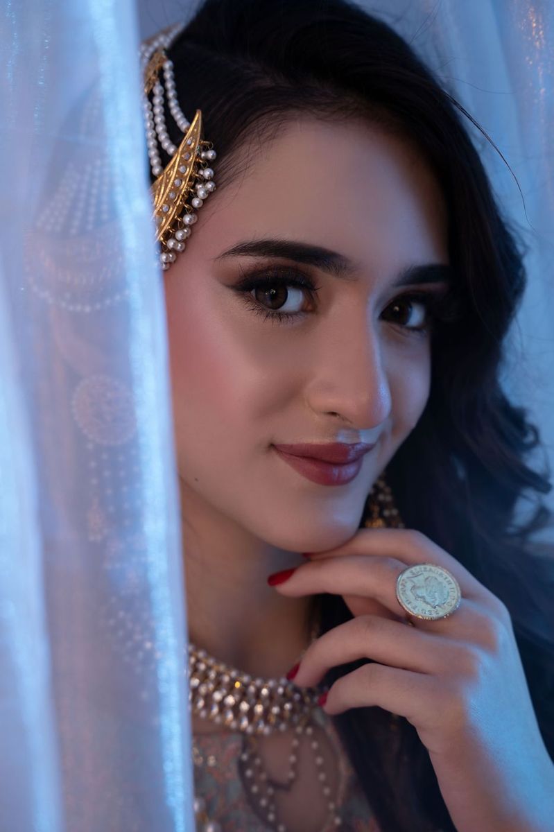 Mehndi look behind sheer curtains