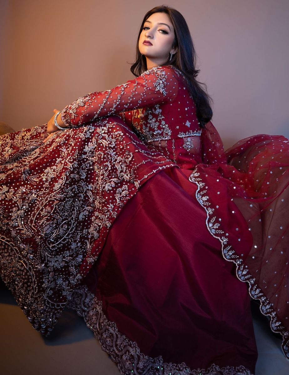 Bride in a deep red embellished gown
