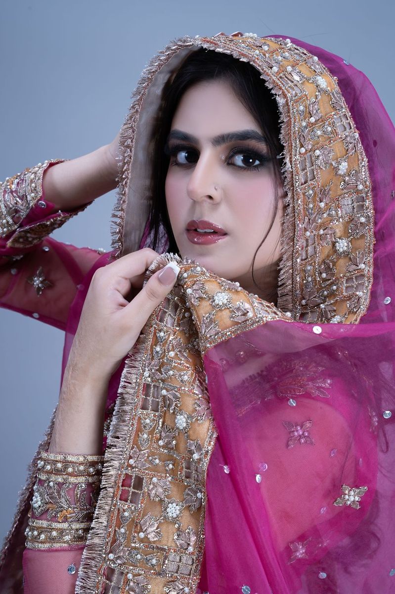 Bride in a fuchsia flared gown