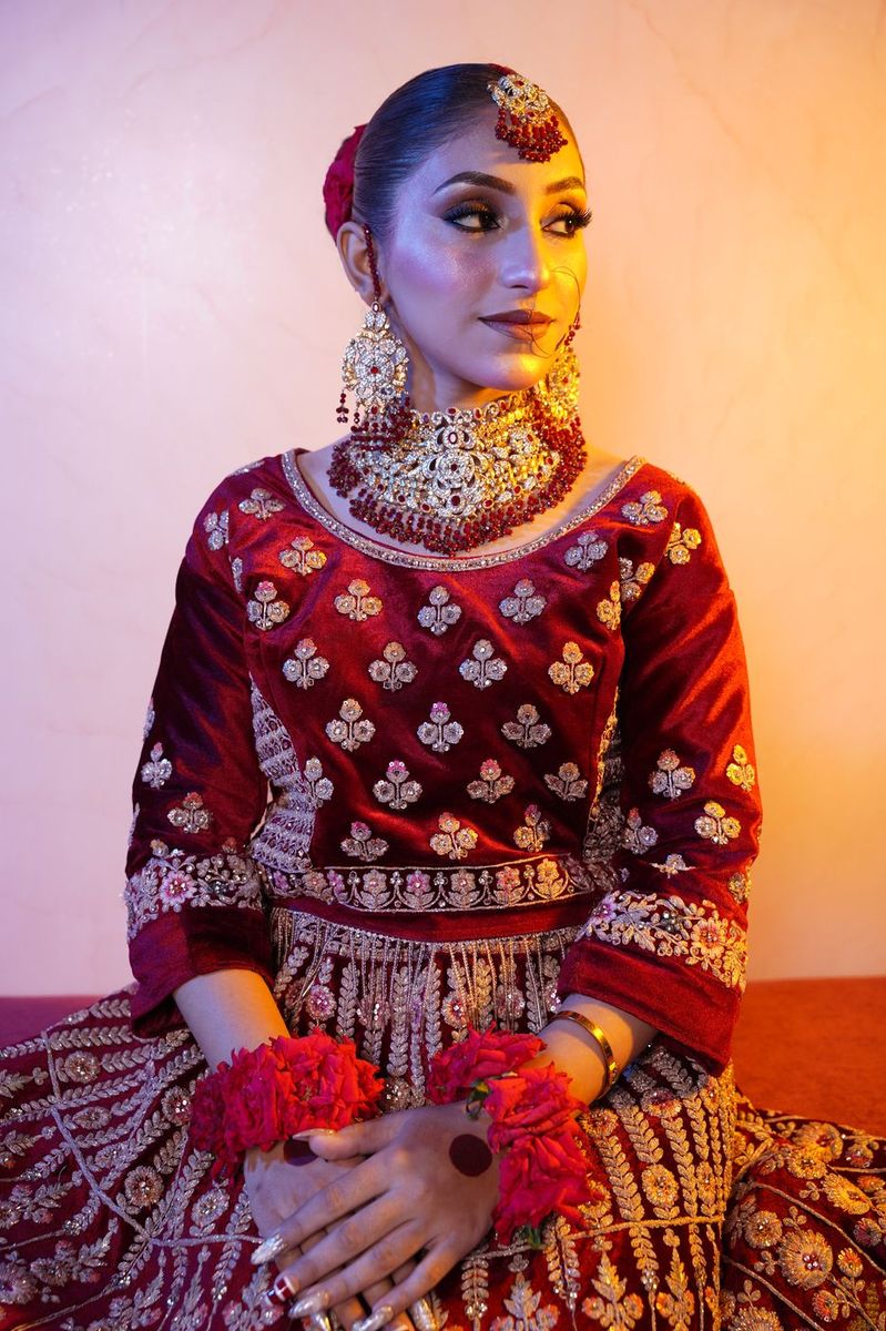 Bride in maroon velvet with gold work