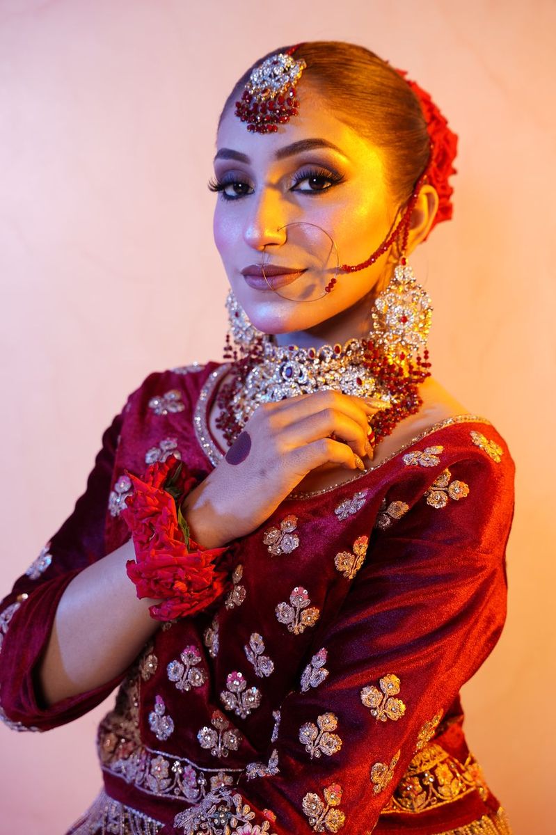 Bride in maroon velvet with gold work