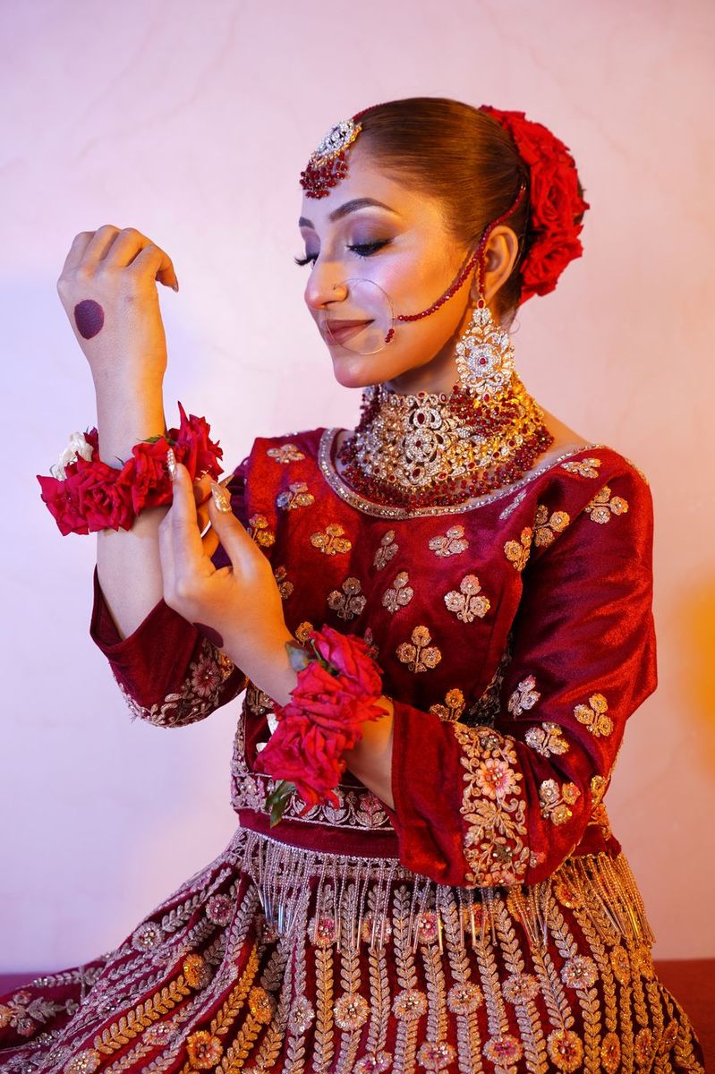 Bride in maroon velvet with gold work