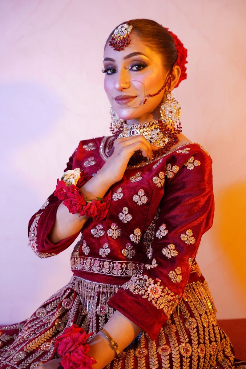 Bride in maroon velvet with gold work