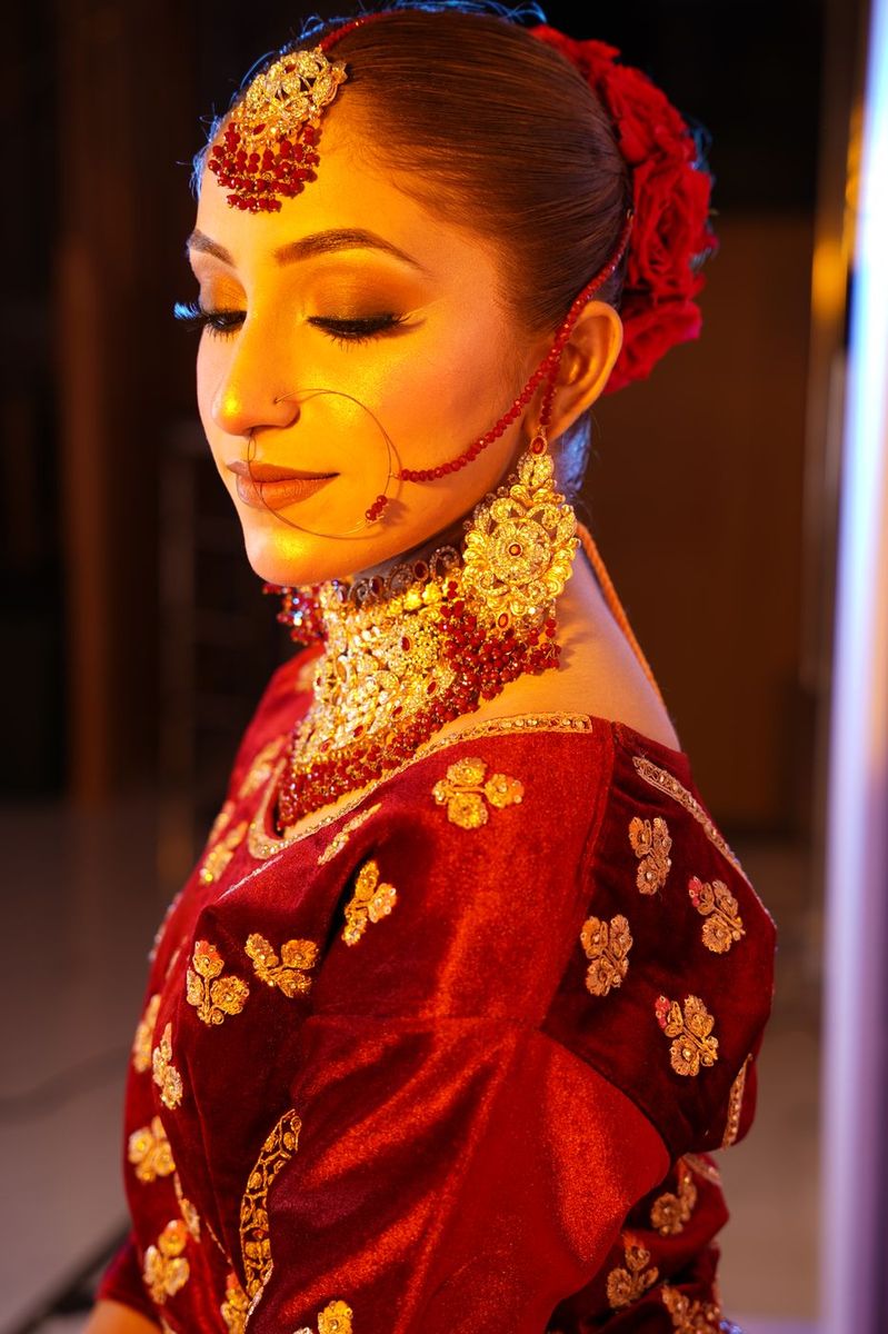 Bride in maroon velvet with gold work