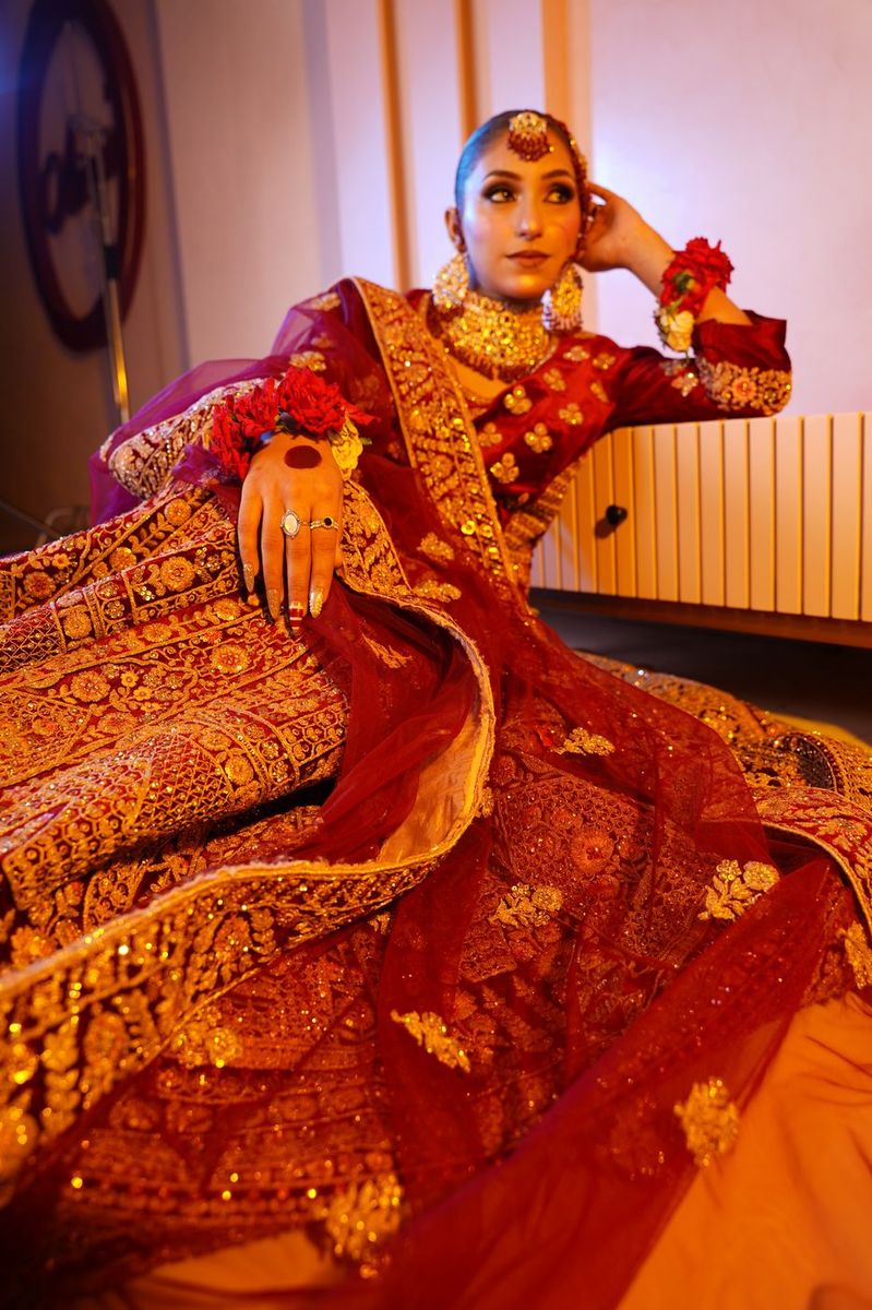 Bride in maroon velvet with gold work