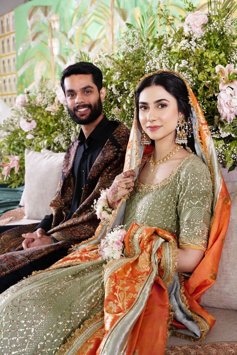 Bridal couple in green and gold