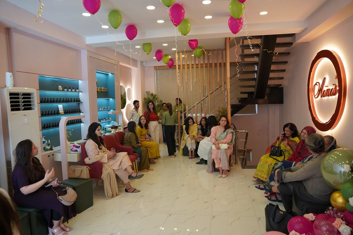 Guests filling Aini's Salon & Studio on opening day