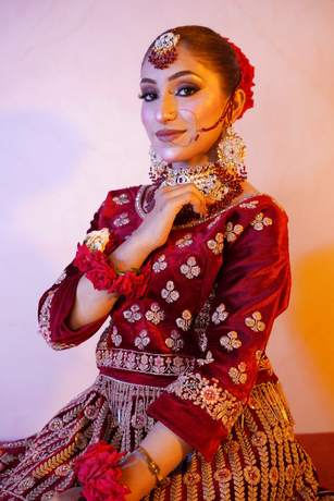 Bride in maroon velvet with gold work