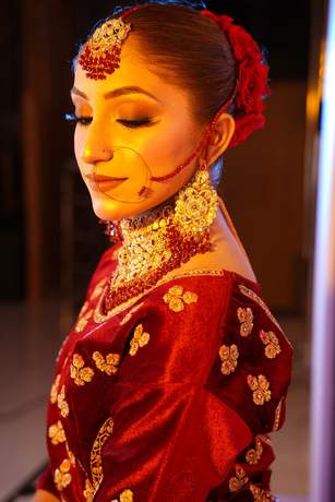 Bride in maroon velvet with gold work