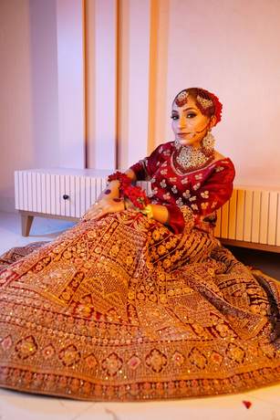 Bride in maroon velvet with gold work