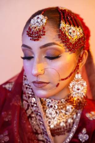 Bride in maroon velvet with gold work